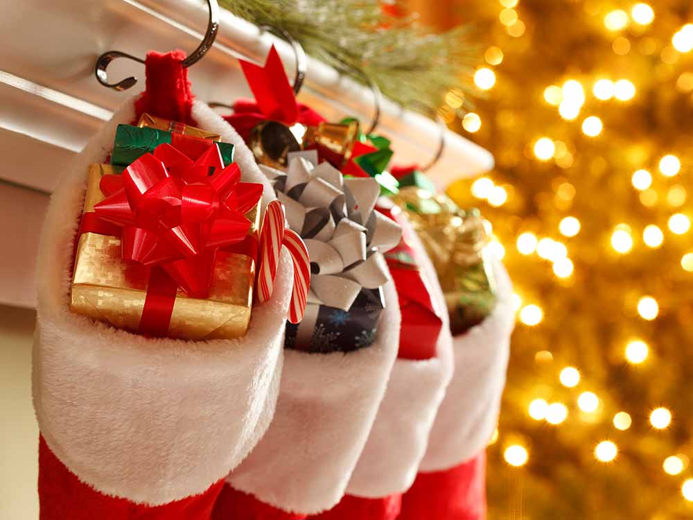 Christmas stockings with wrapped presents inside.