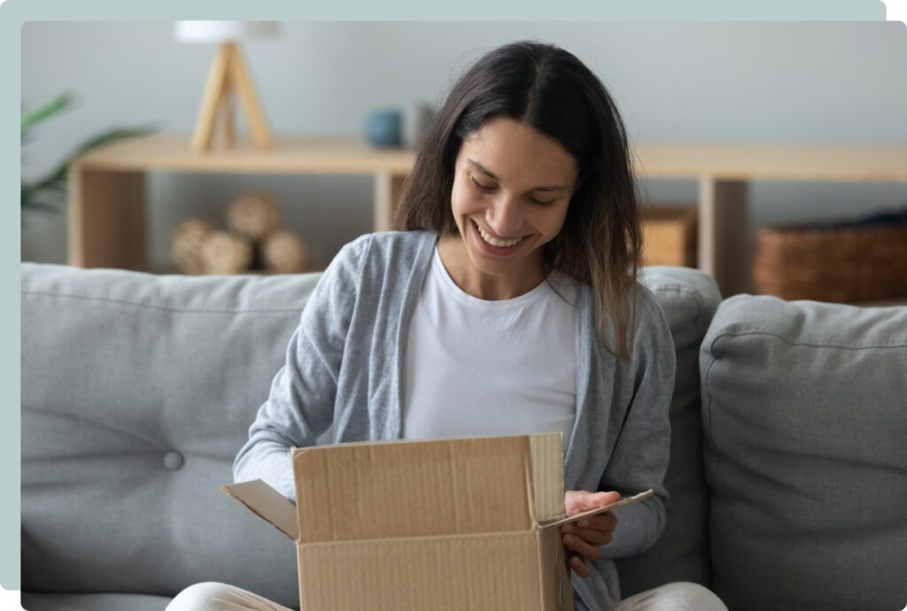 Joyful woman opening gift